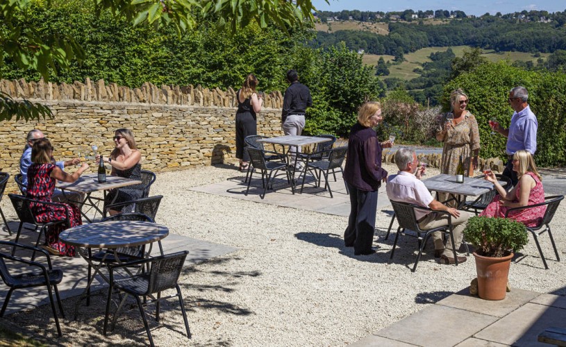 People sat on terrace in vineyard